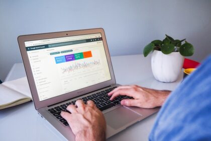 a person typing on a laptop