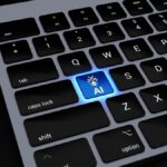 a close up of a keyboard with a blue light on it