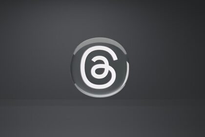 a white and black logo on a black background
