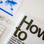 a book with a keyboard and mouse on a table