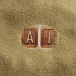 A close up of a word written in sand