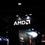 Amd logo illuminated on a dark ceiling