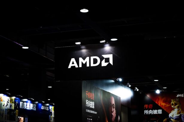 Amd logo illuminated on a dark ceiling