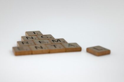 a scrabble of letters spelling a pyramid of words