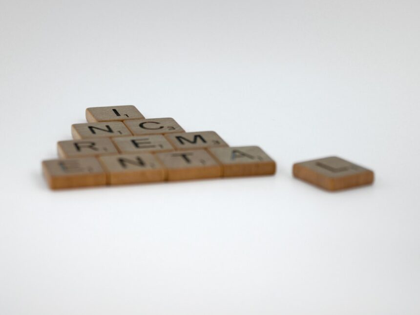 a scrabble of letters spelling a pyramid of words