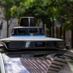 Self-driving car with sensors on city street