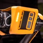 a close up of a yellow and black motorcycle