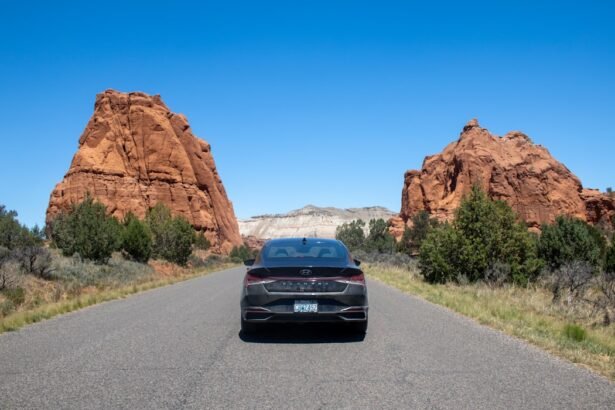 A car driving down a road in the desert