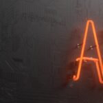 a neon neon sign that is on the side of a wall