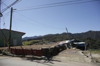 Rural landscape with buildings and rolling hills