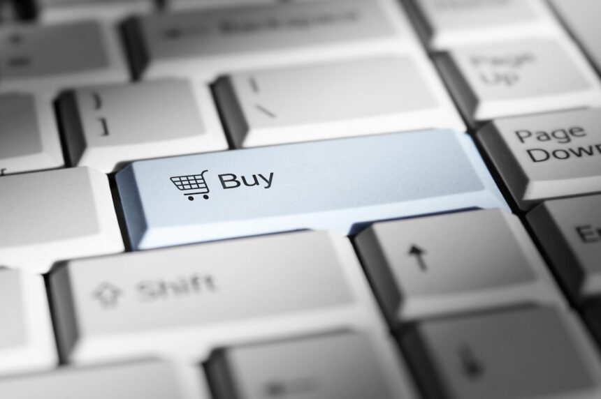 Close-up of a keyboard with a prominent 'buy' button