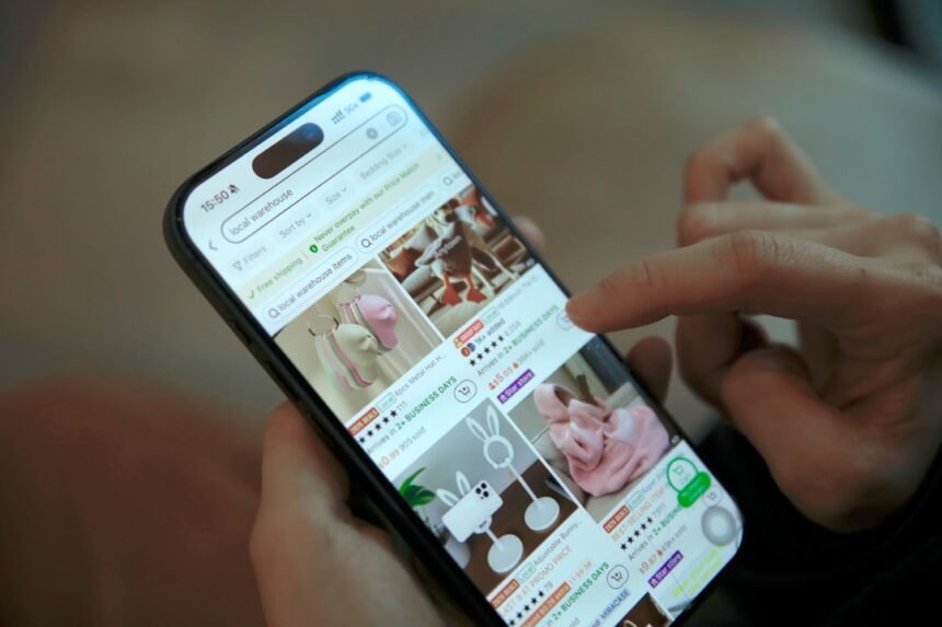 Person scrolling through online shopping on phone