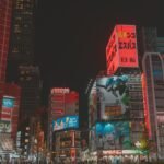 Vibrant cityscape with illuminated buildings at night