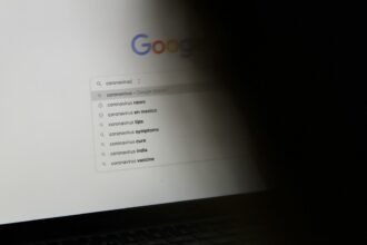 black laptop computer turned on displaying google search