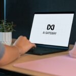 Person typing on laptop with "ai gateway" logo