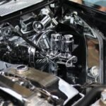 Classic car engine with shiny chrome components and details