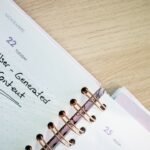 a close up of a planner on a table