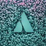 a blue triangle surrounded by pink and blue bubbles